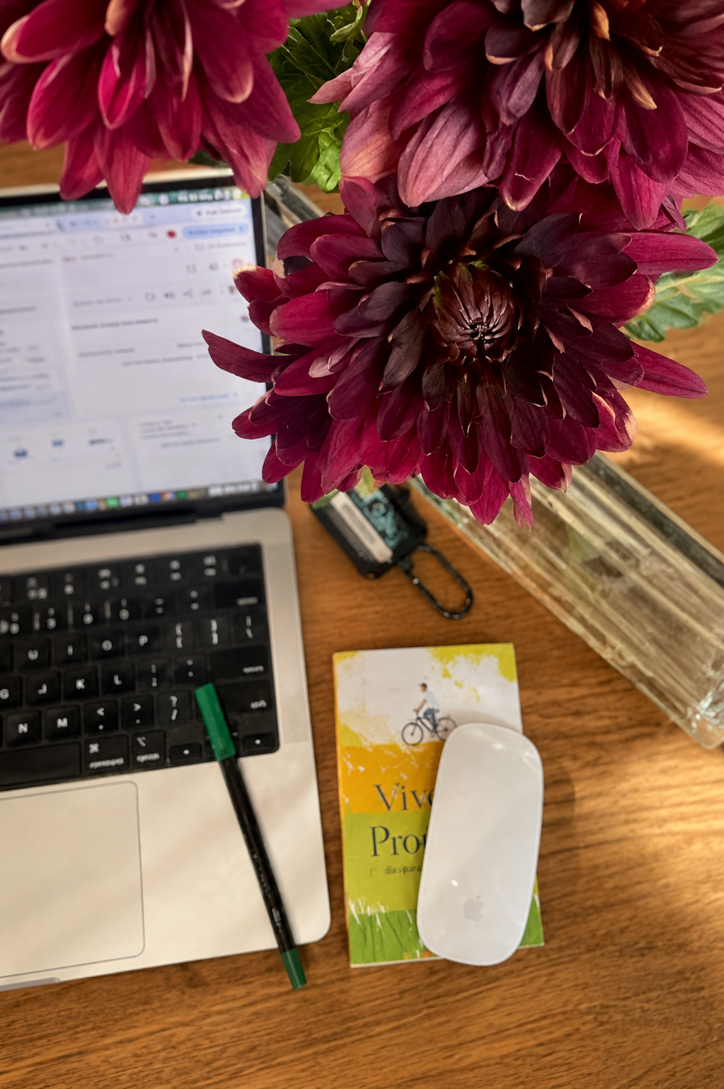 Creative workspace setup with laptop, flowers and editing tools for content creation and digital marketing in Sydney
